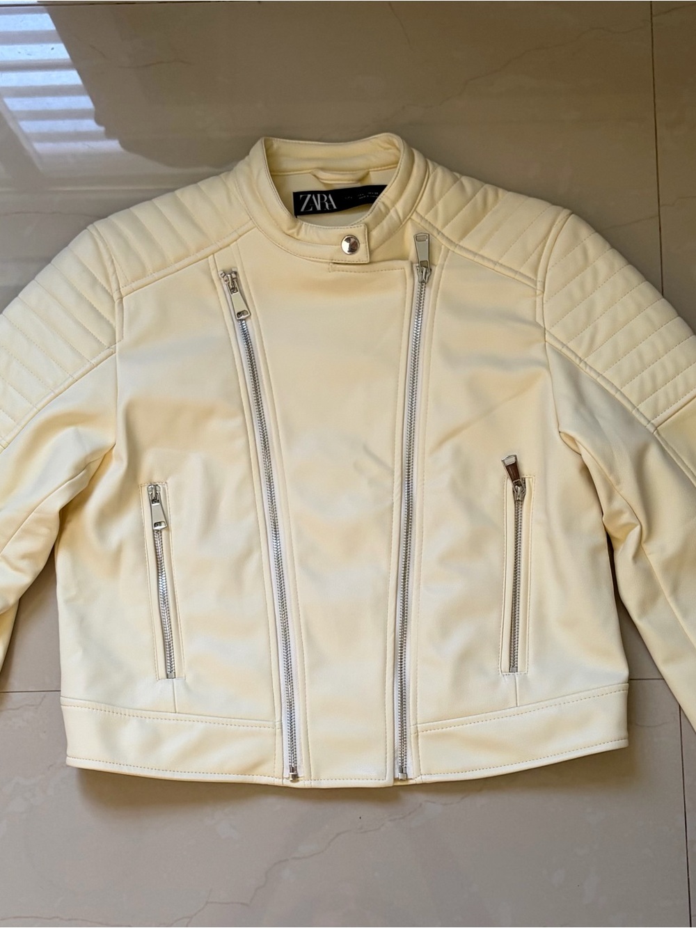 Butter-yellow leather jacket from Zara.